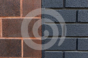 Dark orange and black brick wall texture background close-up