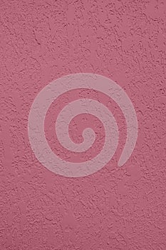 dark pink colored low contrast Concrete textured background with roughness and irregularities