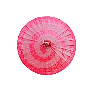 Dark pink oil paper umbrella with water drops top view isolated on white background and clipping path