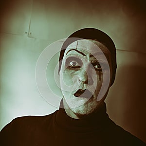 Dark portrait of actor with mime makeup