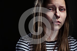 Dark portrait of a depressed teen girl