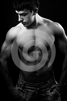 Dark portrait of man with muscular body