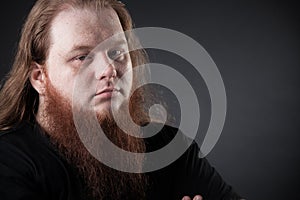 Dark portrait of a respectable man in the studio.