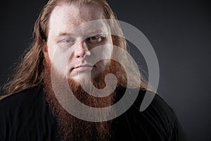 Dark portrait of a respectable man in the studio.