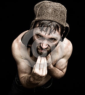 Dark portrait of scary evil sinister bearded man with smirk, makes various hand's signs and expresses different emotions