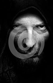 Dark portrait of scary evil sinister man photo