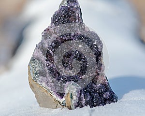 Dark purple Amethyst Quartz Druse Geode from Uruguay on white snow