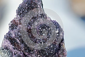 Dark purple Amethyst Quartz Druse Geode from Uruguay on white snow