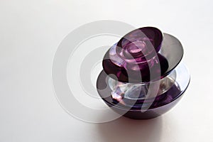 Dark purple glass perfume bottle with a copy space