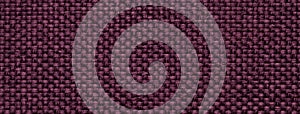 Dark purple woven textile macro texture background. Knitted wine fabric pattern for material design and backdrop