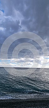 Dark rain clouds over the sea