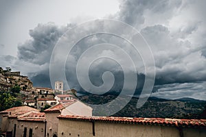 Dark rainy clouds above Savoca village in Sicily, Italy