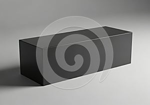 A dark rectangular box sits on a plain surface isolated on white background