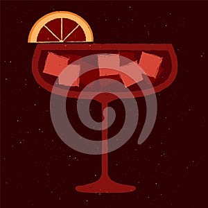 Dark red cocktail with ice cubes and grapefruit in margarita glass. Mulled wine