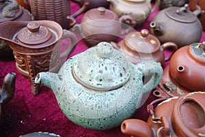 Dark-red enameled pottery teapot