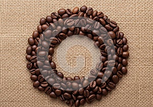 Dark roasted coffee beans arranged in