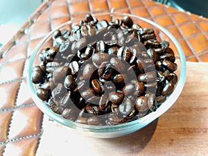 Dark roasted coffee beans cloes up