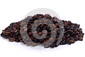 Dark roasted coffee beans on white background