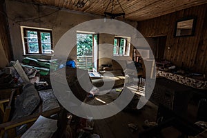 dark room with open door in a house in the forest