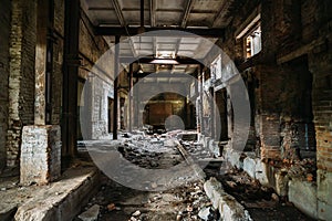 Dark scary corridor in abandoned industrial ruined brick factory, creepy interior, perspective