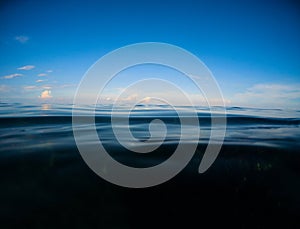 Dark sea and deep blue sky. Double landscape with sea water and sky.