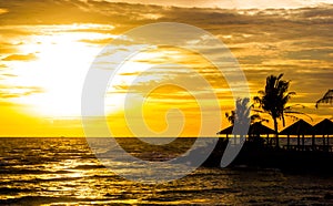 dark silhouette of cloudy sky on sunset at tropical island in sea