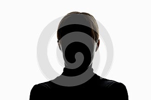 Dark silhouette of girl isolated on white background, the concept of anonymity photo