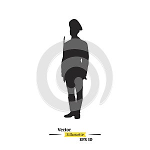 Dark silhouette of a soldier with a rifle on a white background. A soldier stands on a post. Flat illustration EPS 10