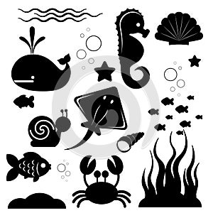 Dark silhouettes of different sea animals, fish and marine objects on a white background