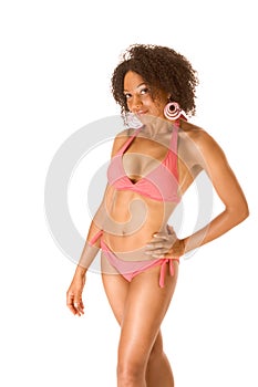 Dark skinned female in pink swimsuit