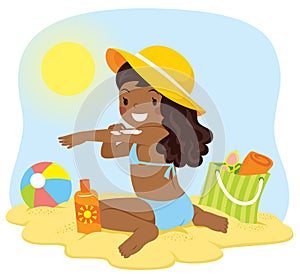 Dark skinned girl putting on sunscreen photo