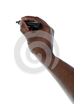 Dark-skinned hand skecthing photo