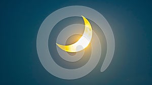 Dark sky with a bright crescent sun in a partial solar eclipse. Concept of solar eclipse, sky phenomenon, astronomy