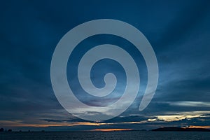 Dark sky with rain clouds over the sea