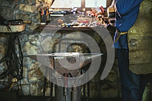 Dark smithy with blacksmith tools