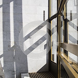 Dark smooth lines of shadows in a light marble interior