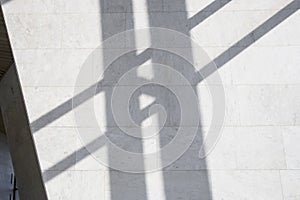 Dark smooth lines of shadows in a light marble interior