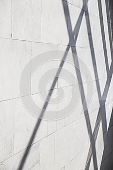 Dark smooth lines of shadows in a light marble interior