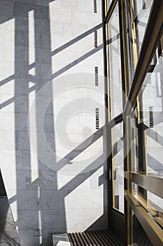 Dark smooth lines of shadows in a light marble interior