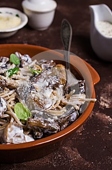 Dark spaghetti with mushrooms