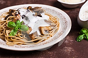 Dark spaghetti with mushrooms