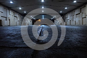 Dark spooky underpass at night, low angle