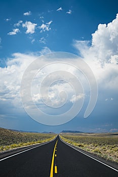 Dark storm clouds above desert highway