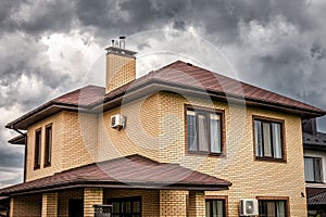 Dark storm clouds above house rooftops