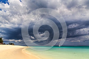 Dark storm clouds above a tropical beach