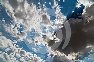 Dark storm clouds on a bright blue sky