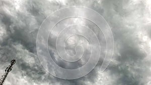 Dark Storm Clouds with Communication Tower Under Dramatic Sky