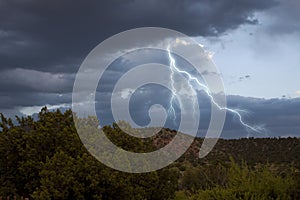 Dark storm clouds with lightning photo
