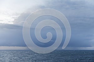 Dark storm clouds over the sea