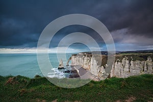 Dark storm sky over rocks in Atlantic ocean